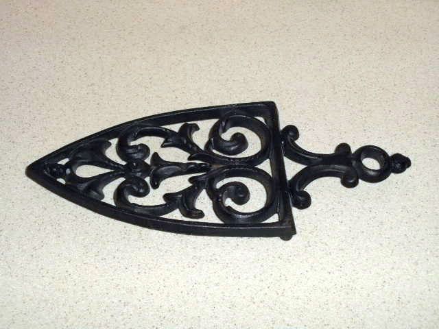   Wilton cast iron heavy trivet triangle shape footed scrolls VGC  